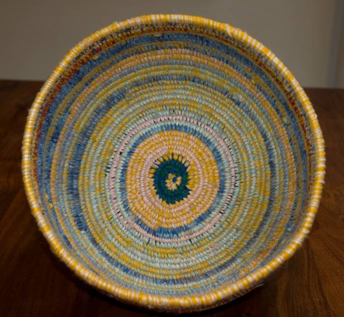 Australian Indigenous (Aboriginal and Torres Strait Islander) artwork by YIKARTU BUMBA of Martumili Artists. The title is Basket. [09-009] (Spinifex and Acrylic Wool)