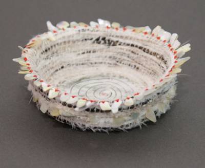 Australian Indigenous (Aboriginal and Torres Strait Islander) artwork by LISA WAUP of Baluk Artists. The title is Bloodlines. [14-18] (Found Materials and Fibres)