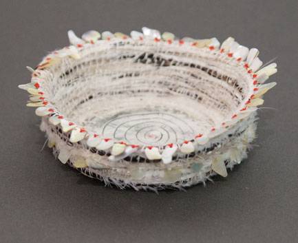 Australian Indigenous (Aboriginal and Torres Strait Islander) artwork by LISA WAUP of Baluk Artists. The title is Bloodlines. [14-18] (Found Materials and Fibres)