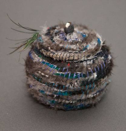 Australian Indigenous (Aboriginal and Torres Strait Islander) artwork by LISA WAUP of Baluk Artists. The title is Blue Bird. [101-18] (Found Materials and Fibres)