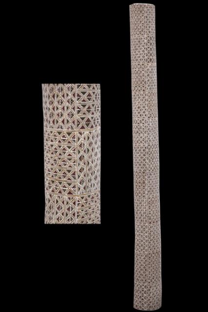 Australian Indigenous (Aboriginal and Torres Strait Islander) artwork by DJIRRIRRA WUNUNGMURRA of Buku-Larrnggay Mulka (Yirrkala). The title is Buyku. [3664G] (Earth Pigments on Hollowed Pole)