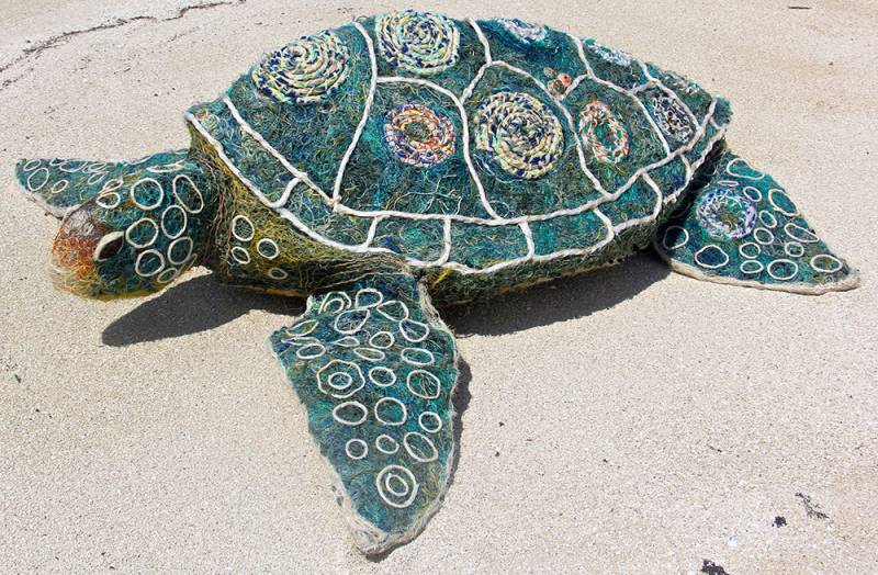 Australian Indigenous (Aboriginal and Torres Strait Islander) artwork by VARIOUS ERUB ERWER META ARTISTS (COLLABORATIVE) of Erub Erwer Meta. The title is Emarr Totol. [17-32] (Ghost Nets, Rope & Twine over Steel Frame)