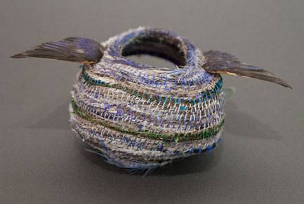 Australian Indigenous (Aboriginal and Torres Strait Islander) artwork by LISA WAUP of Baluk Artists. The title is Following Home. [609-17] (Found Materials and Fibres)