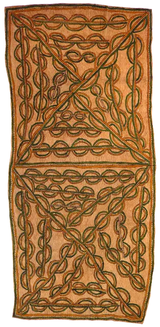 Australian Indigenous (Aboriginal and Torres Strait Islander) artwork by PENNYROSE SOSA of Omie Artists. The title is Hartu’e – Cassowary breast-bone necklace. [15-088] (Natural Pigments on Nioge (Barkcloth))