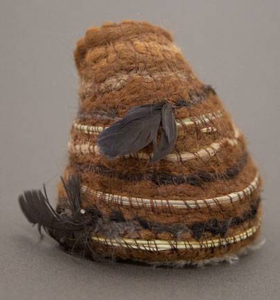 Australian Indigenous (Aboriginal and Torres Strait Islander) artwork by GILLIAN GARVIE of Baluk Artists. The title is Home. [113-18] (Found Materials and Fibres)