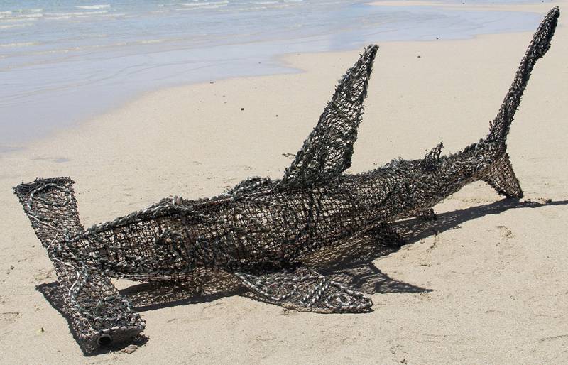 Australian Indigenous (Aboriginal and Torres Strait Islander) artwork by VARIOUS ERUB ERWER META ARTISTS (COLLABORATIVE) of Erub Erwer Meta. The title is Irawapap. [17-34] (Ghost Nets, Rope & Twine over Steel Frame)