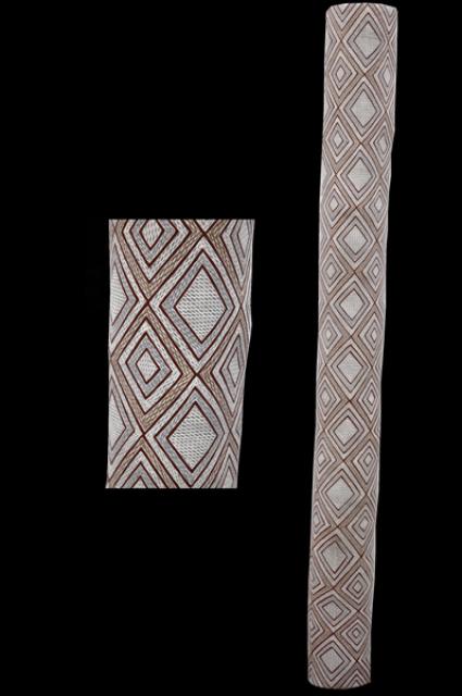 Australian Indigenous (Aboriginal and Torres Strait Islander) artwork by GARAWAN WANAMBI of Buku-Larrnggay Mulka (Yirrkala). The title is Marrangu. [3661R] (Earth Pigments on Hollow Log)