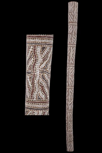 Australian Indigenous (Aboriginal and Torres Strait Islander) artwork by BARAYUWA MUNUNGGURR of Buku-Larrnggay Mulka (Yirrkala). The title is Munyuku. [3601V] (Earth Pigments on Hollow Log)