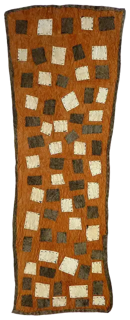 Australian Indigenous (Aboriginal and Torres Strait Islander) artwork by BRENDA KESI (ARIRÉ) of Omie Artists. The title is Taliobamë’e – Ancestral Design of the Mud. [15-074] (Appliquéd Mud-Dyed Nioge (Barkcloth))