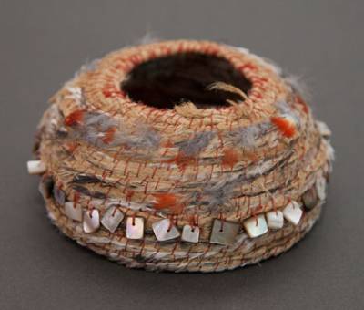 Australian Indigenous (Aboriginal and Torres Strait Islander) artwork by LISA WAUP of Baluk Artists. The title is Tapping into Identity. [226-15] (Found Materials and Fibres)