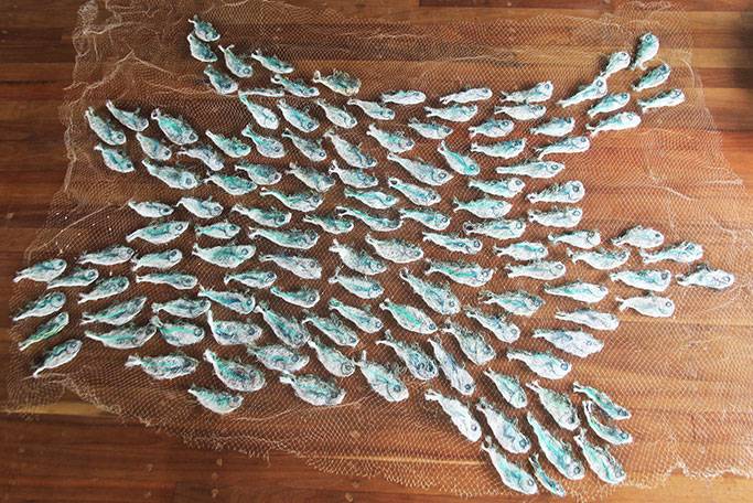 Australian Indigenous (Aboriginal and Torres Strait Islander) artwork by LYNNETTE GRIFFITHS of Miscellaneous Artists. The title is Tup - Sardines. [LG201705002_2/11] (Ghost Nets & Rope)