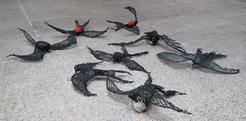 Australian Indigenous (Aboriginal and Torres Strait Islander) artwork by JIMMY JOHN THAIDAY of Erub Erwer Meta. The title is Waumer (Frigate Birds) - Pirates of the Air. [15-112] (Ghost Nets & Twine over Steel Frame)