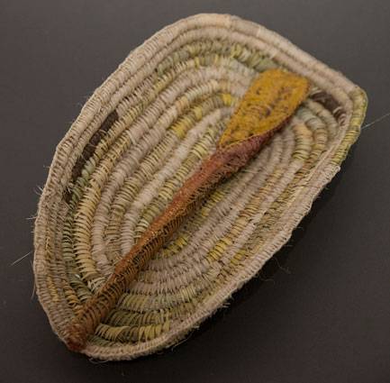 Australian Indigenous (Aboriginal and Torres Strait Islander) artwork by CASSIE LEATHAM of Baluk Artists. The title is Weaved Coolamon with Weaved Digging Stick. [119-18] (Found Materials and Fibres)