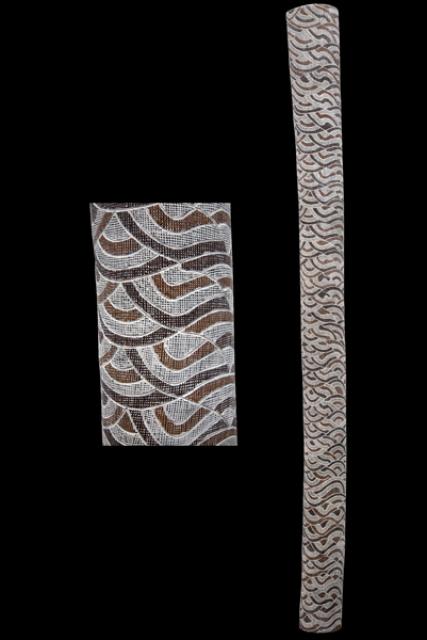 Australian Indigenous (Aboriginal and Torres Strait Islander) artwork by DHURRUMUWUY MARIKA of Buku-Larrnggay Mulka (Yirrkala). The title is Yuta Rulyapa. [3561C] (Natural Earth Pigments on Hollow Trunk)